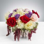 Elegant floral arrangement with roses and cascading amaranthus.