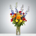 Colorful mixed flower bouquet in a glass vase.