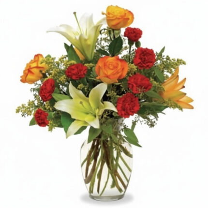 A vibrant bouquet of orange roses, red carnations, and white lilies in a clear vase.