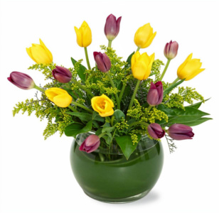 Yellow and purple tulips in a green round vase.