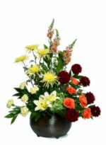 A vibrant bouquet with lilies, roses, and chrysanthemums.
