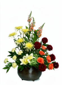 A vibrant bouquet with lilies, roses, and chrysanthemums.