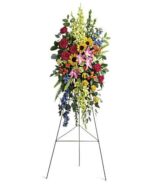 Colorful floral arrangement on a metal stand.