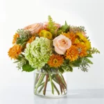 A vibrant floral arrangement in a clear glass vase.