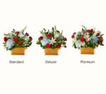 Three variations of a patriotic floral basket arrangement—Standard, Deluxe, and Premium—featuring light blue hydrangeas, red roses, and white lilies in Nashville, TN.